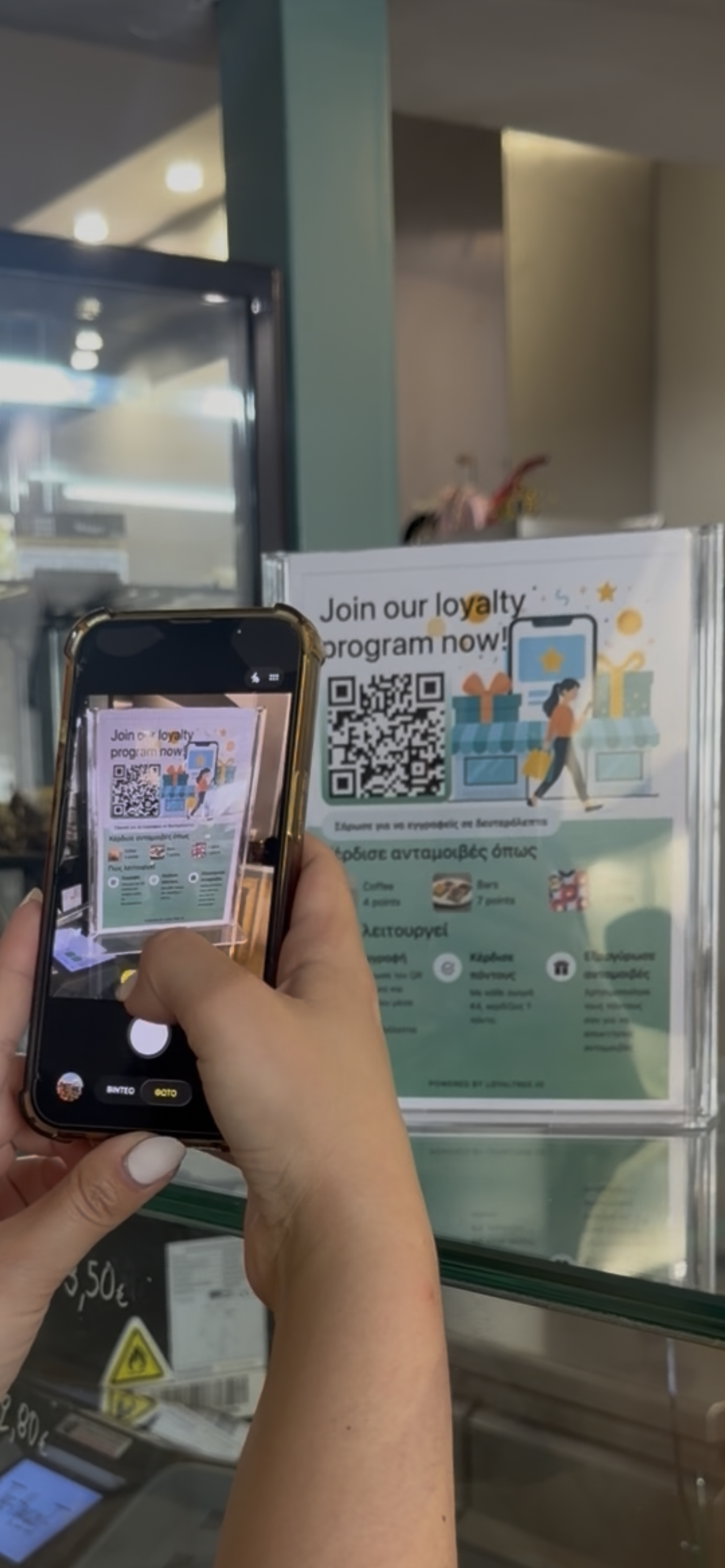 Customer scanning the Loyaltree QR poster